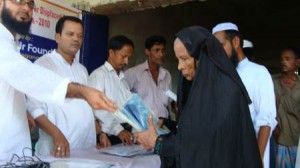 AAK Foundatin Stands beside destitute people